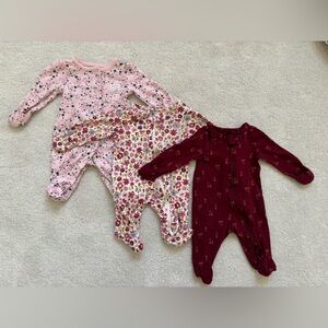 Three newborn sized sleepers.  Minimally worn.  Floral patterns.